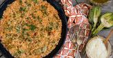 Imagen de Paella de arroz con alcachofas y tomate